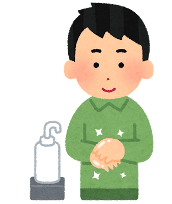 消毒用アルコールを手に消毒中